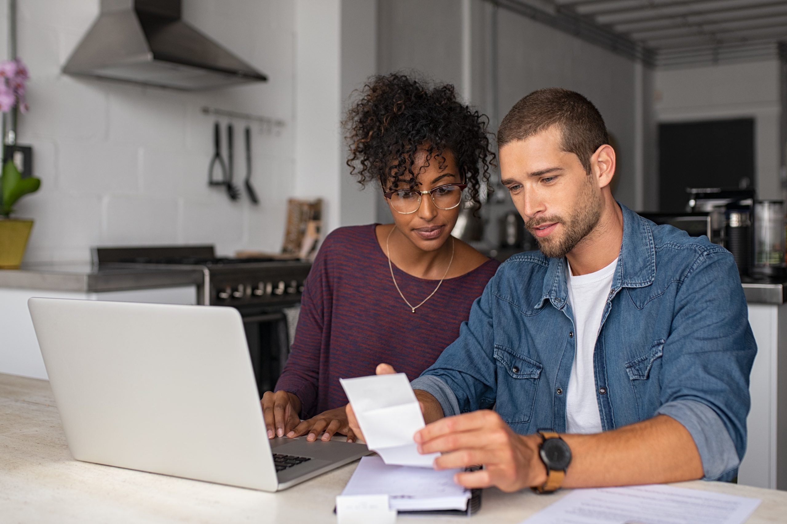 couple looking at the interest rate on a new home loan