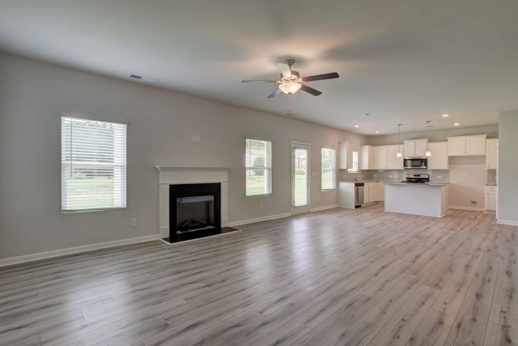 An open-concept family room with fireplace in Pineview Estates